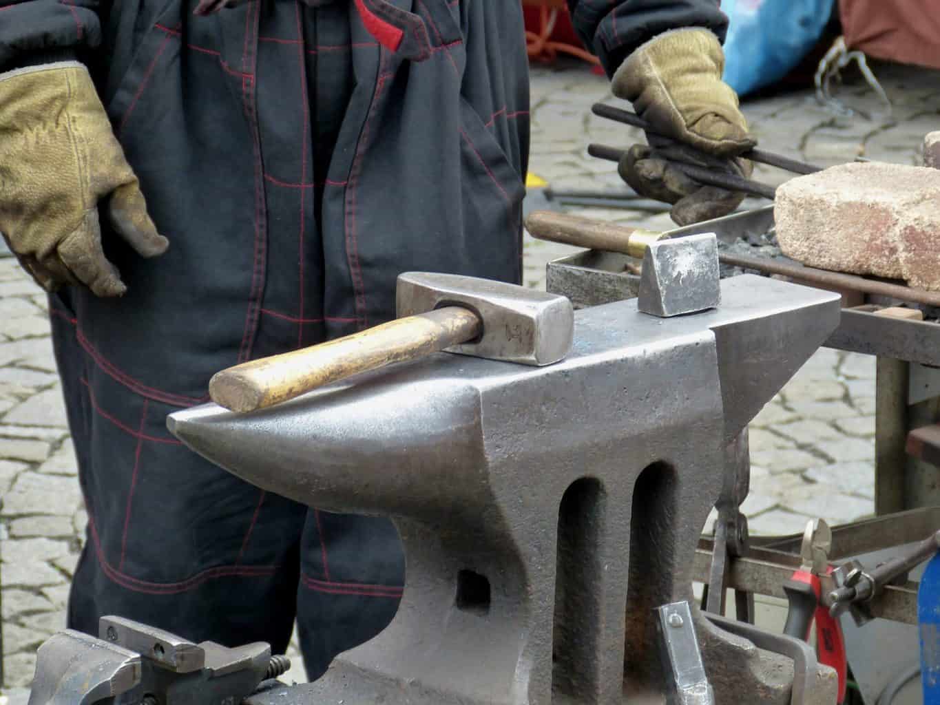An anvil with hand tools on top