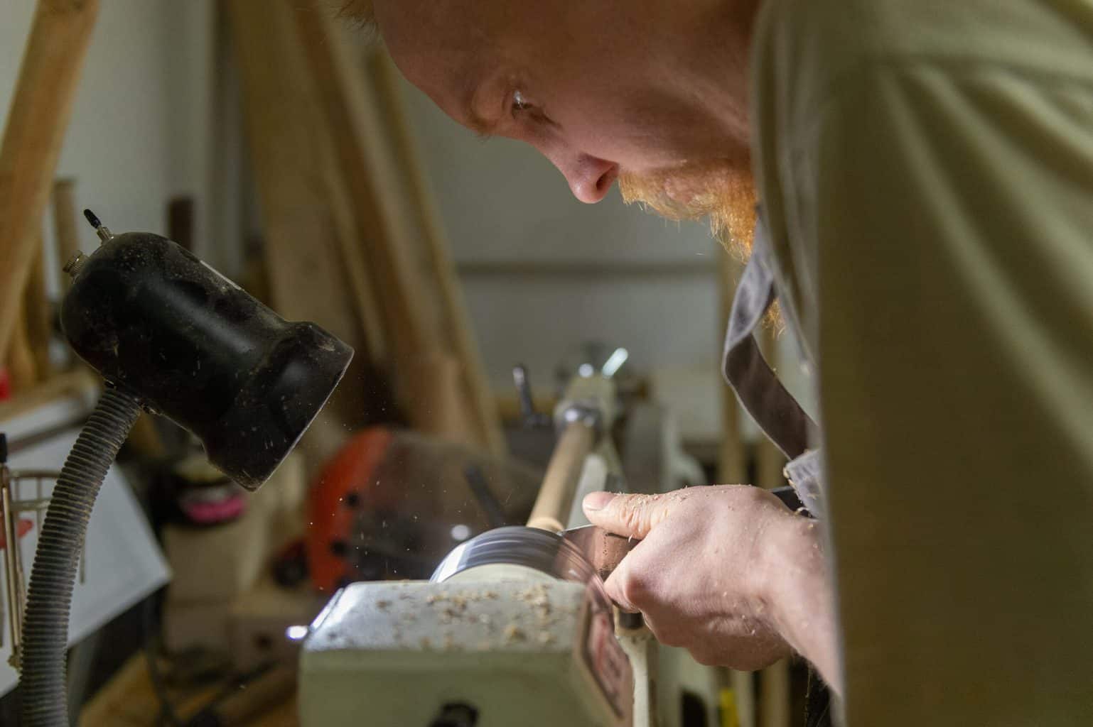 A man handling a metal with light