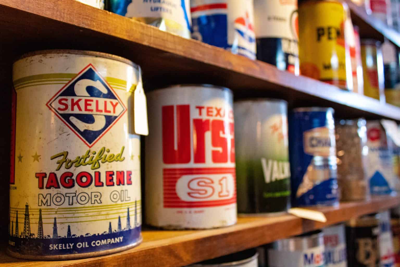 Oil cans stacked on a shelf