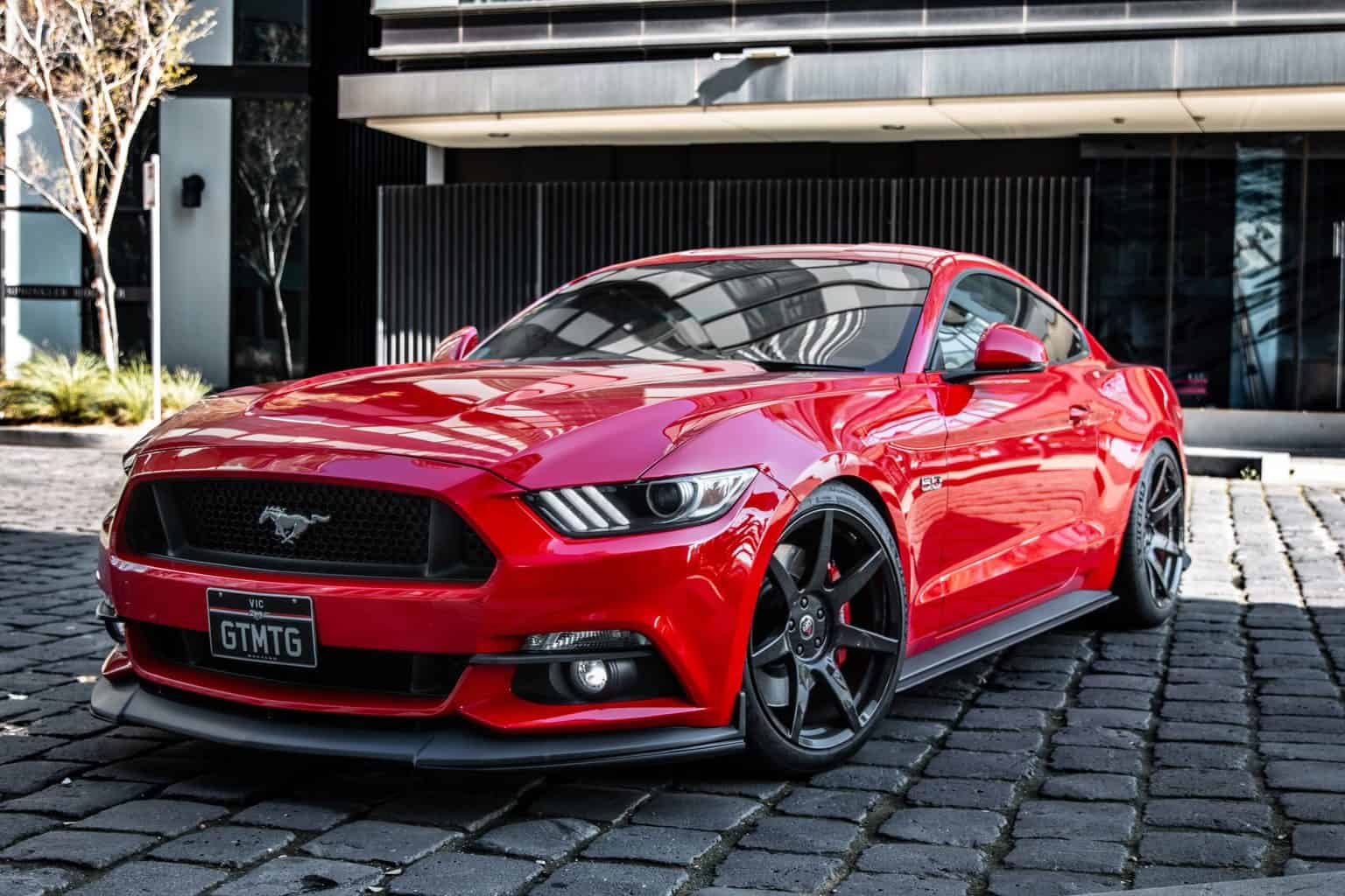 A side view of a red shiny car