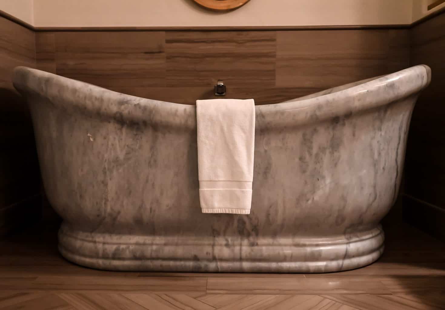 Gray bathtub with towel