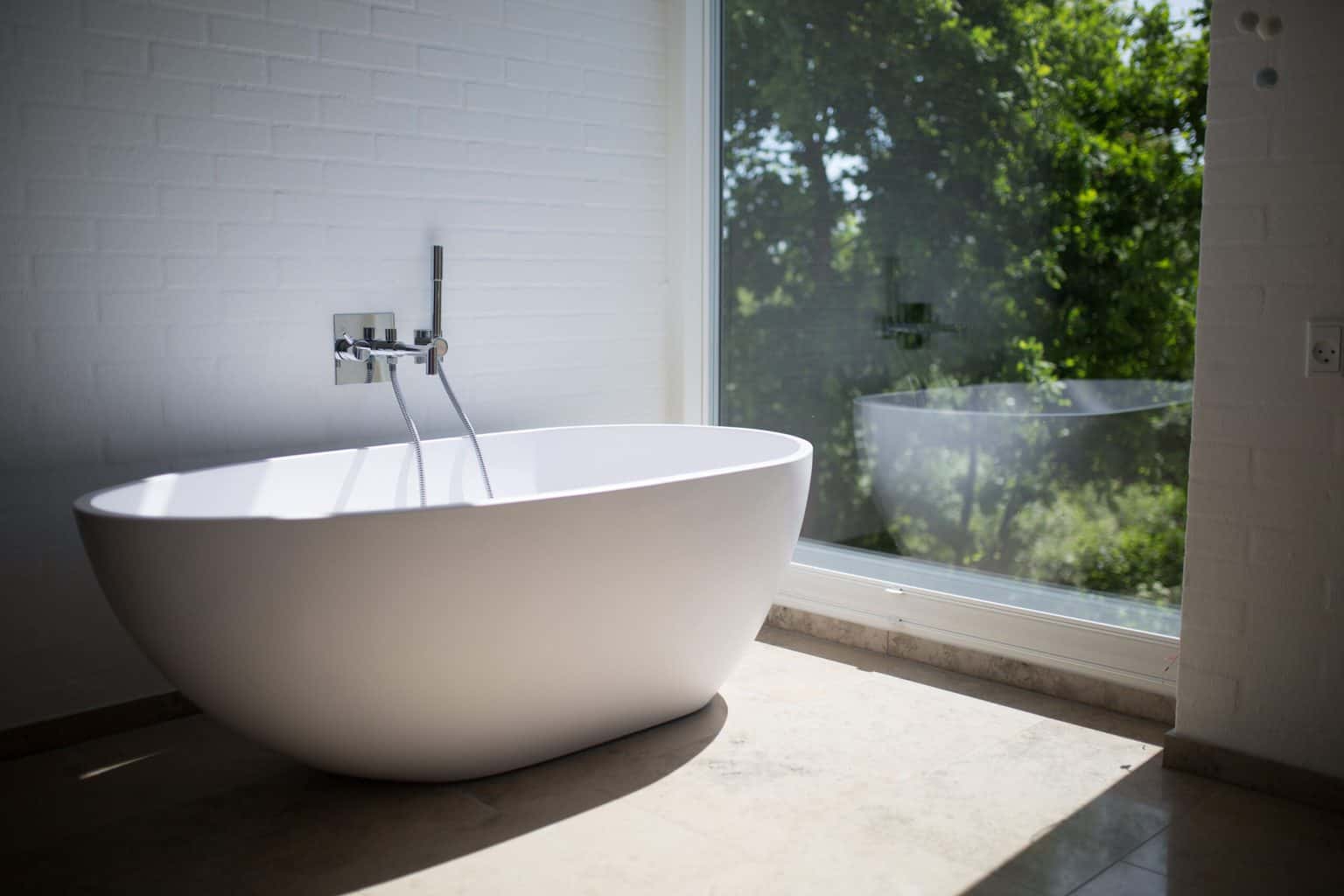 A bathtub near the window