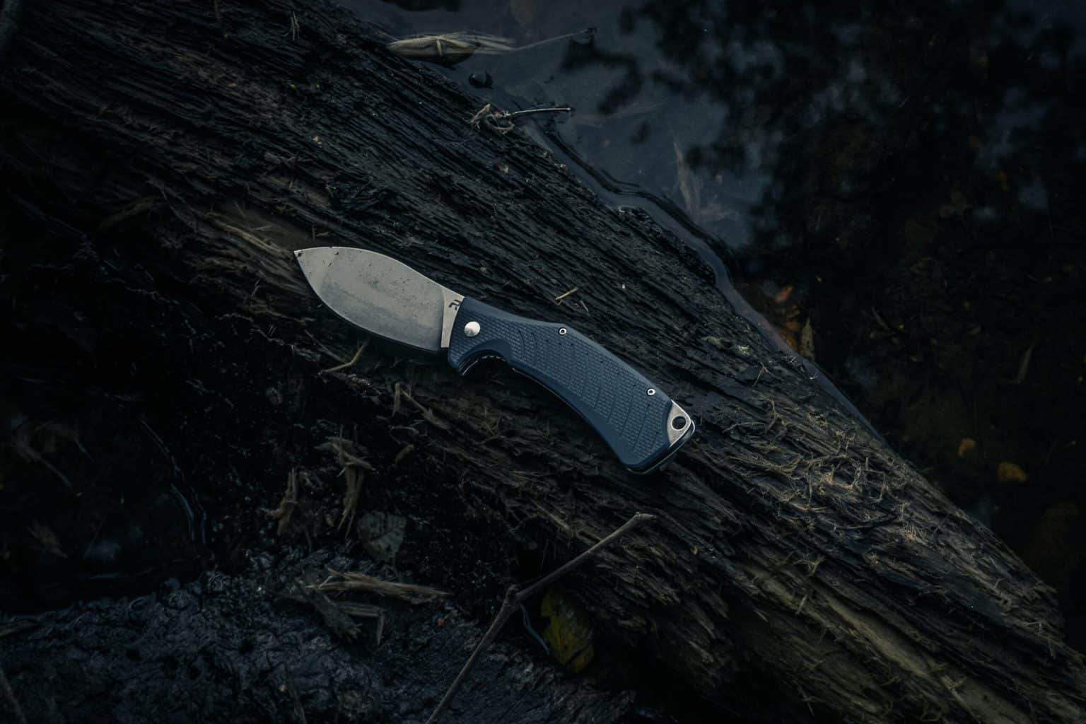 A pocket knife on wood