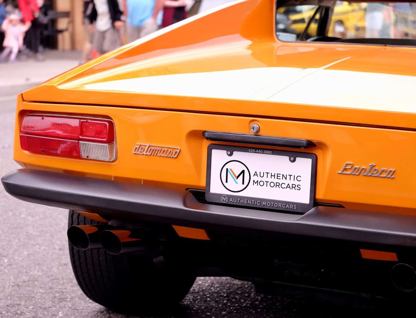 A rear view of an orange car