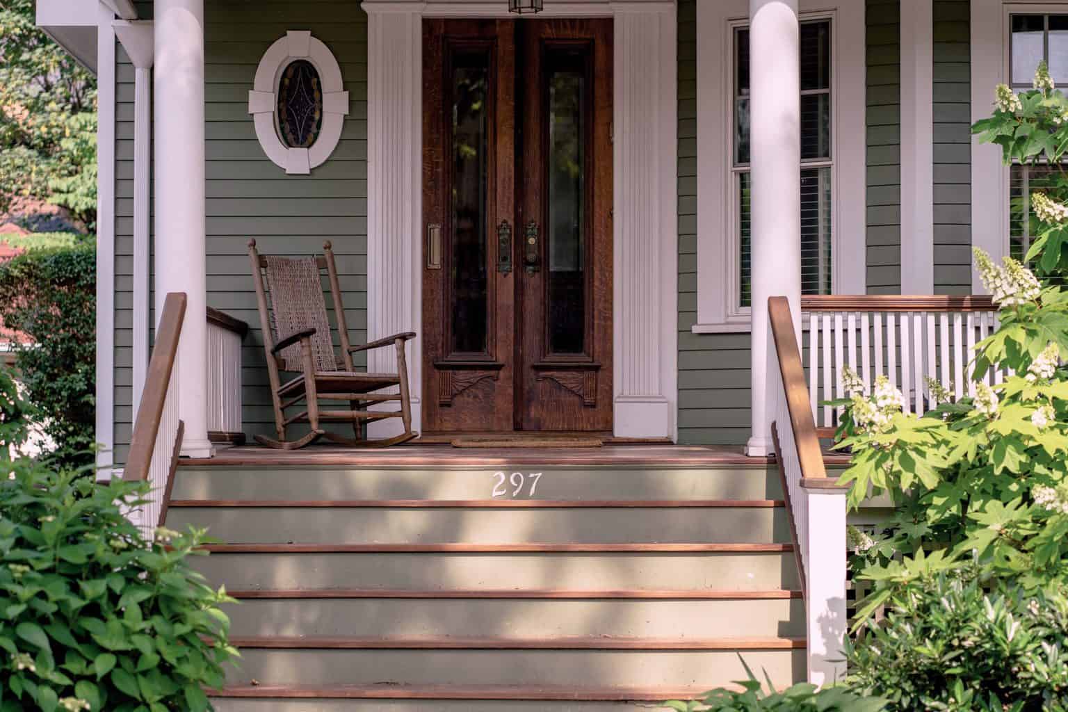 A brown front door in the front porch