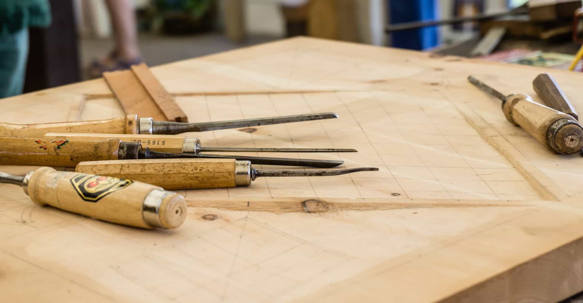 Wood carving tools on top of a wood