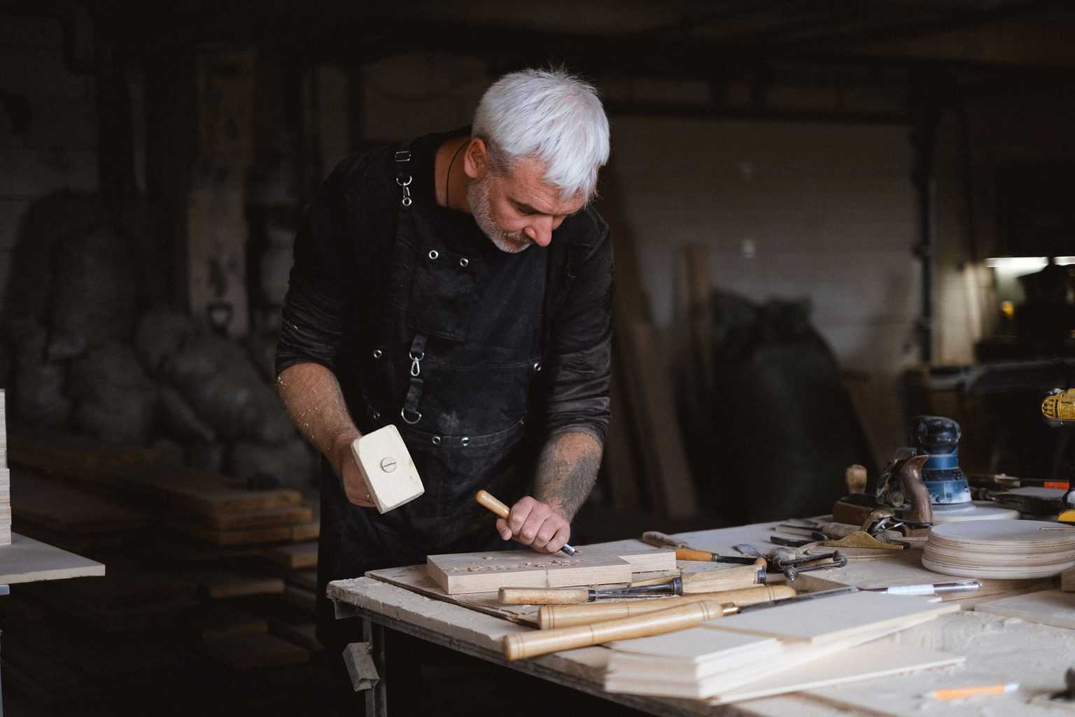A man starting to carve a wood