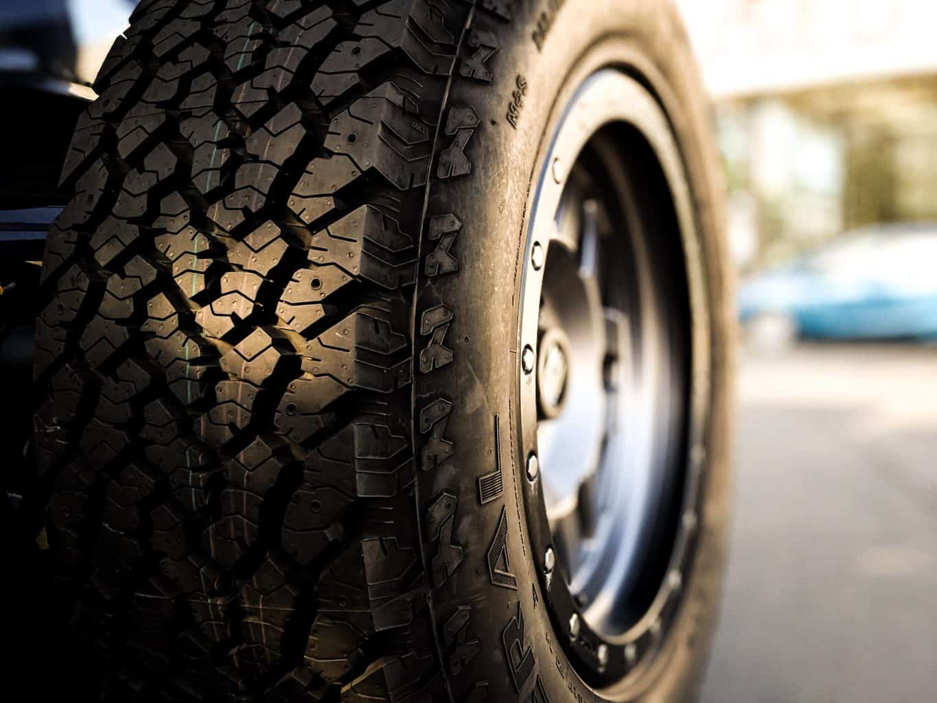 A close up shot of a black tire