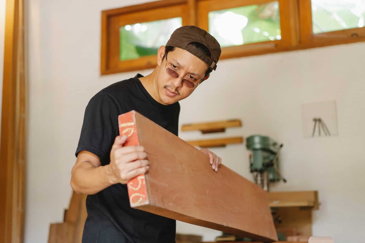 A man checking a wood