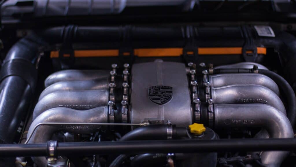 A Porsche car engine block with oil deposit