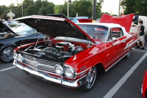 Classic red Chevy with an open hood