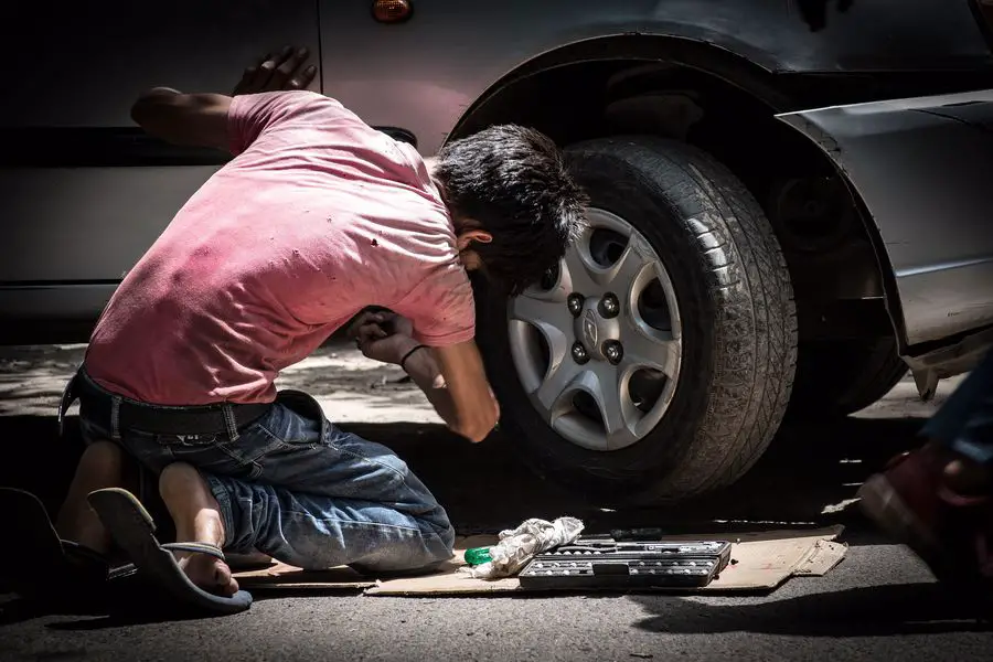 Car mechanic working on a car