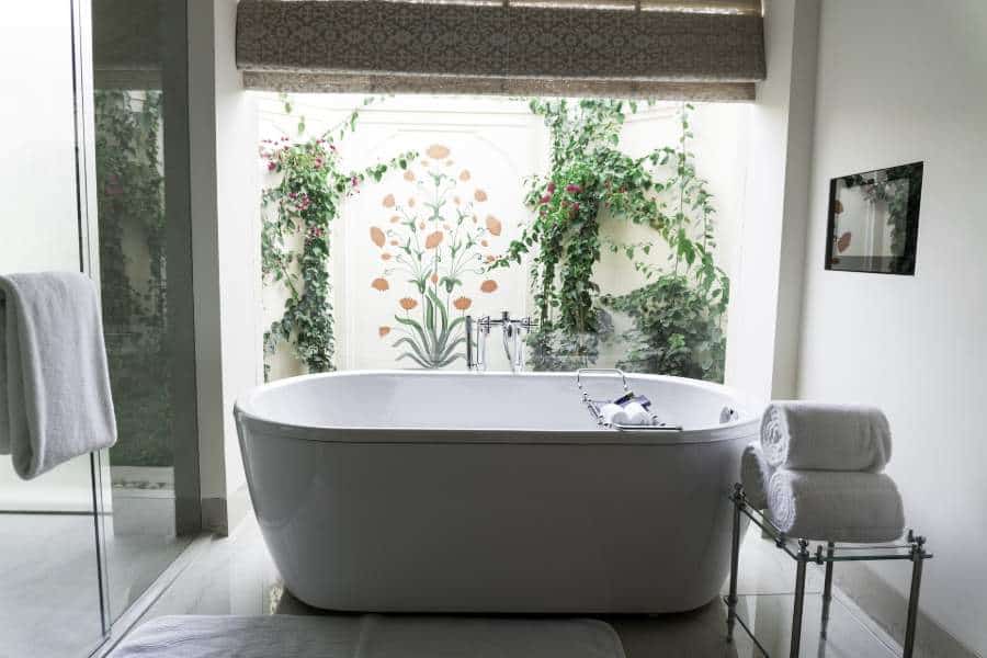 A bathroom with white porcelain bathtub