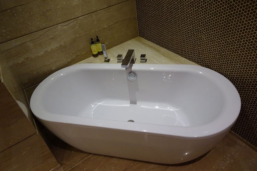 Bathtub on a wooden flooring