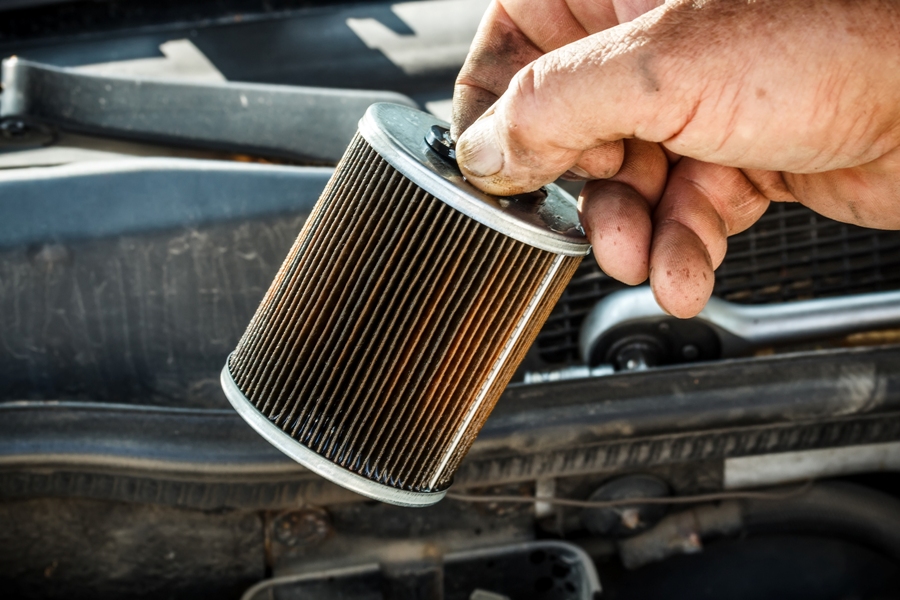 Hand holding a fuel filter